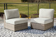 Calworth Outdoor Armless Chair with Cushion (Set of 2) - Yulissa Home Furnishings (NJ)