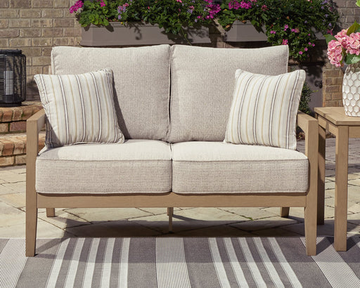 Hallow Creek Outdoor Loveseat with Cushion - Yulissa Home Furnishings (NJ)